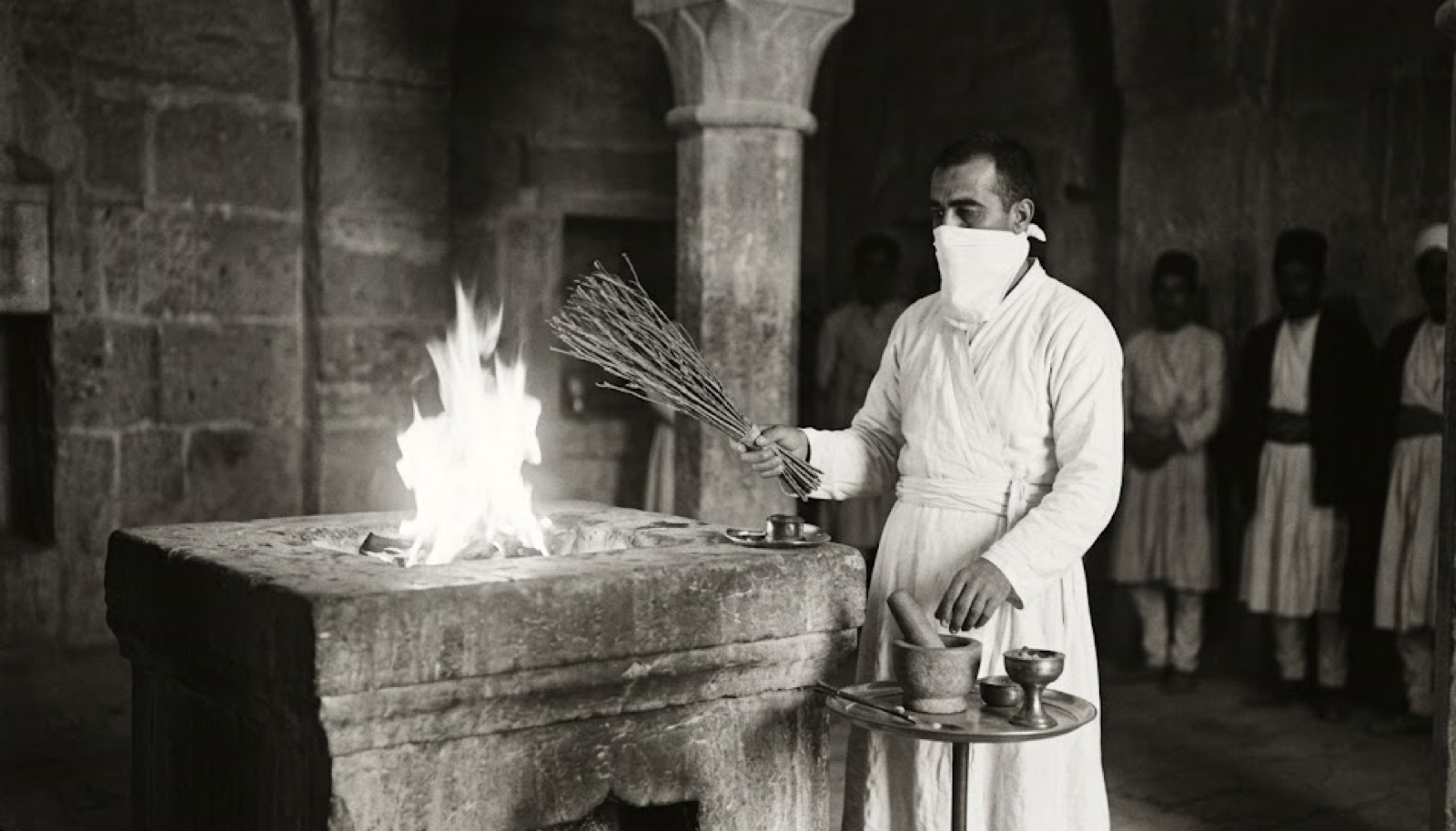 A Moubadān priest performing the Āzarmehr ceremony before the sacred altar fire, c. 1907.