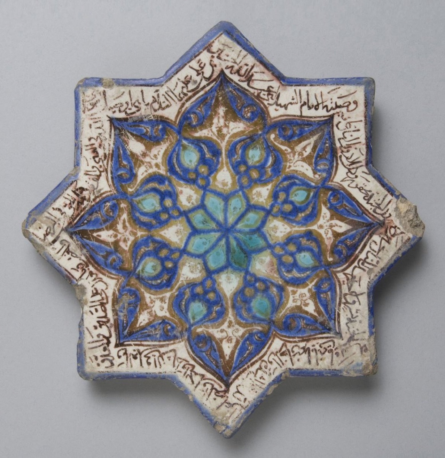 A glazed ceramic Setāre-ye Mehr tile from a Nourestani temple interior, c. 13th century.